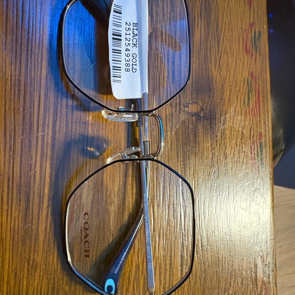 Coach Women's Glasses in Black and Gold